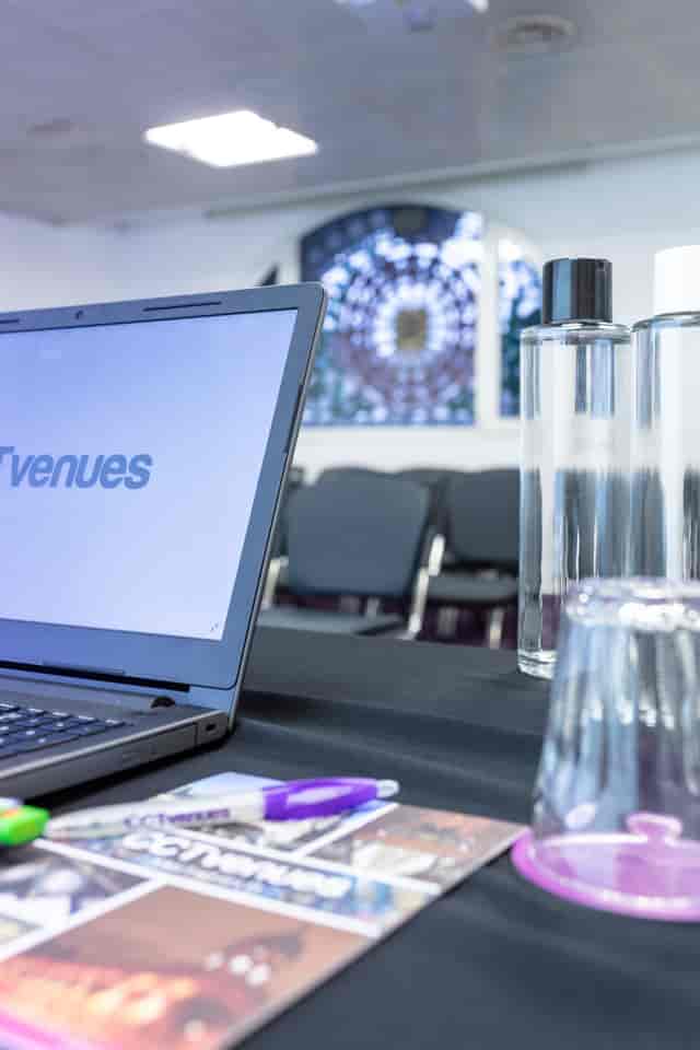 Covent Garden meeting space with laptop setup, ideal for corporate events and conferences.