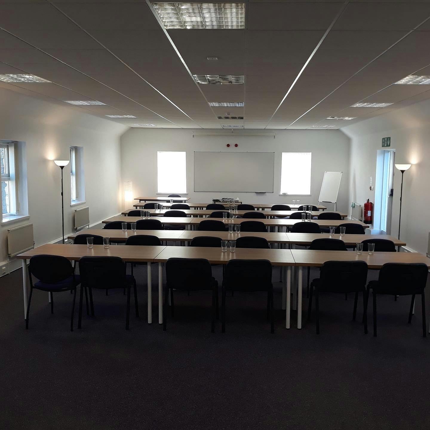 Conference room in North Yorkshire, set up for a workshop with natural light and collaboration.