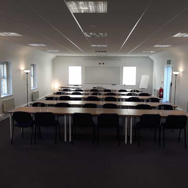 Conference room in North Yorkshire, set up for a workshop with natural light and collaboration.