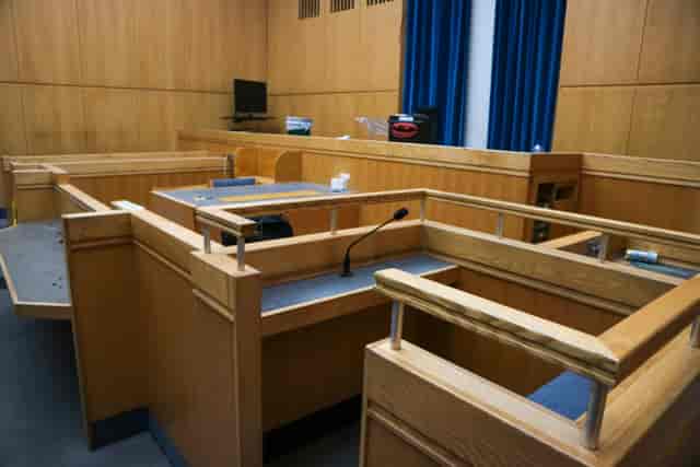 Camberwell Green Magistrate's Courtroom with sleek wooden design for legal events.