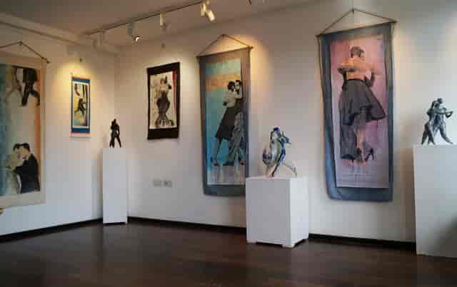 Gallery space with vibrant artwork, ideal for art exhibitions and networking events.