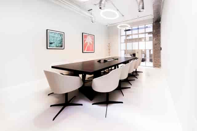 Minimalist boardroom in Fora Clerkenwell with large table for strategy sessions and board meetings.