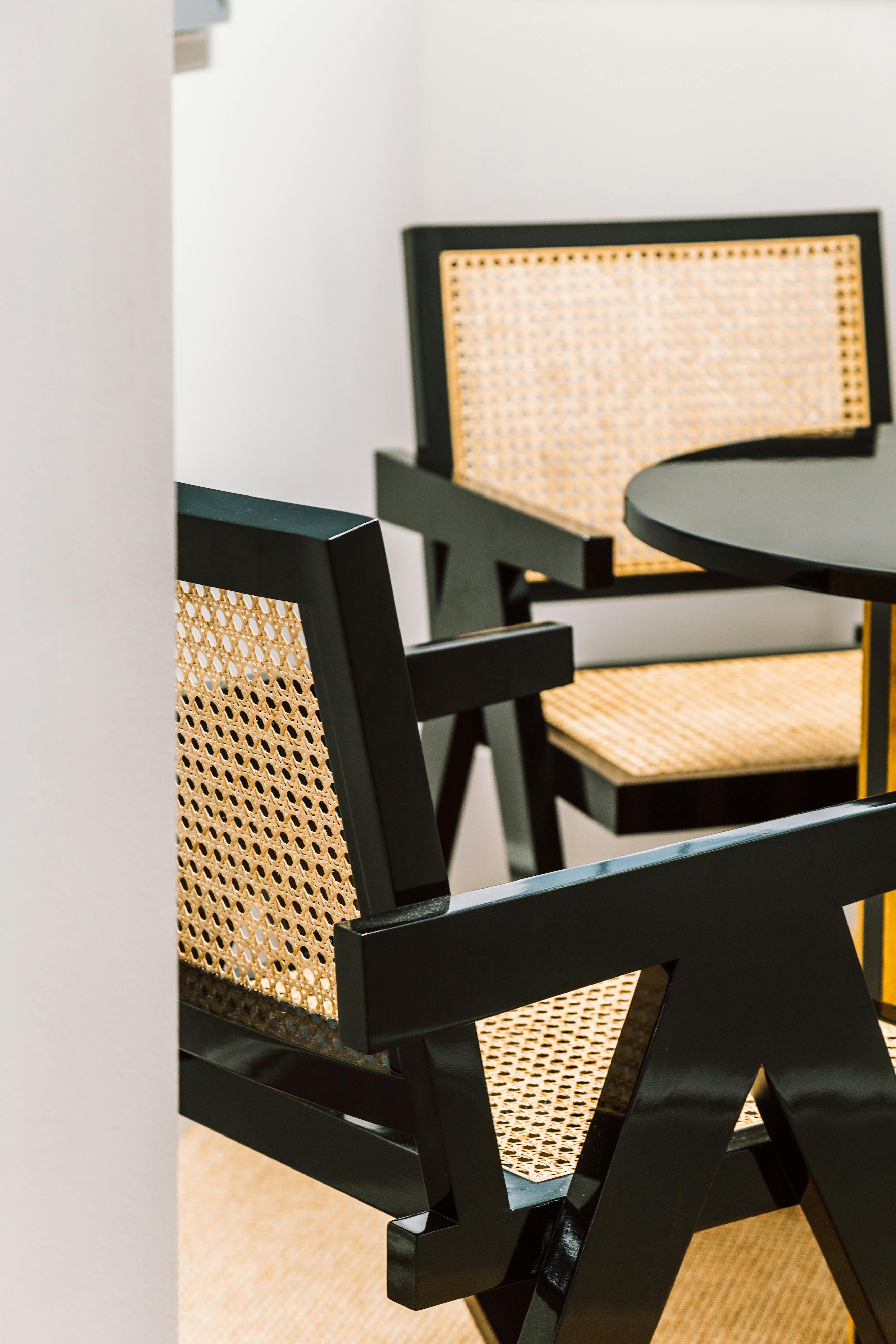 Stylish woven-back chairs in Huckletree for networking events and casual meetings.