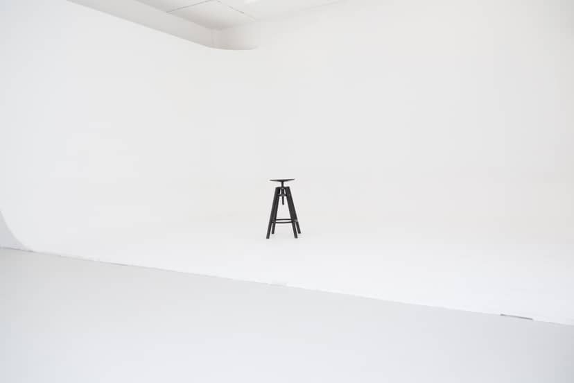 Minimalist Cove Studio setup with white backdrop for presentations and interviews.