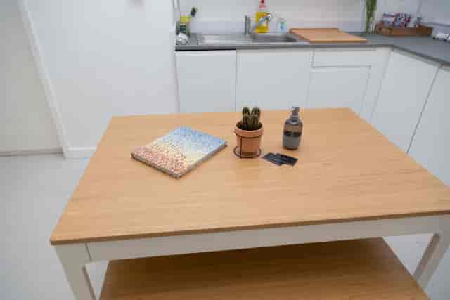 Minimalist workspace at Cove Studio with light wood table for brainstorming sessions.