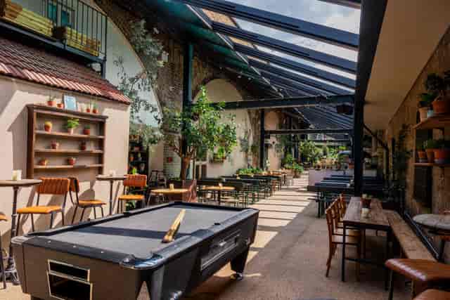 Industrial-chic event venue with natural light for corporate mixers and team-building sessions.