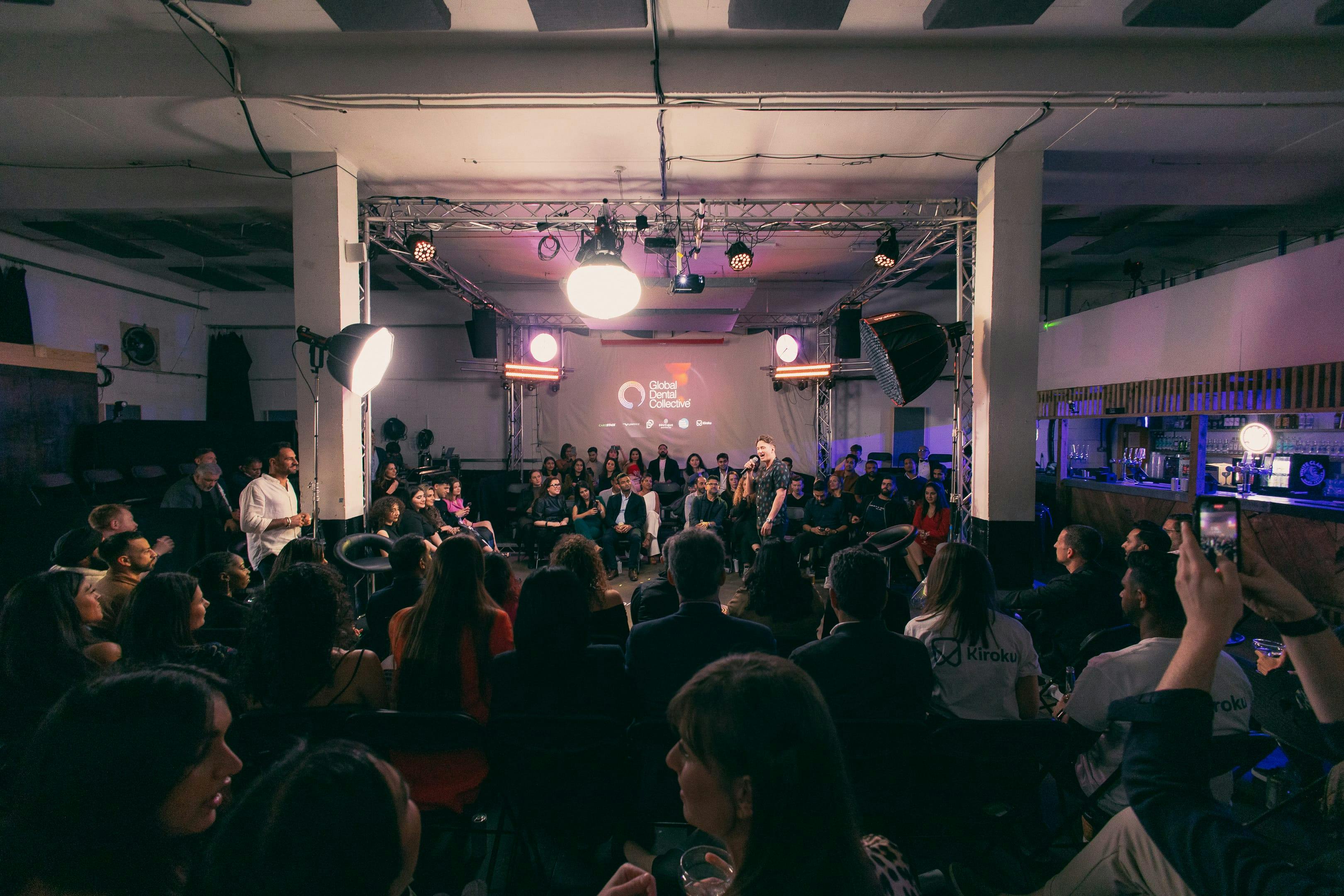 Dynamic event space with engaged audience at Studio 9294 for networking and collaboration.