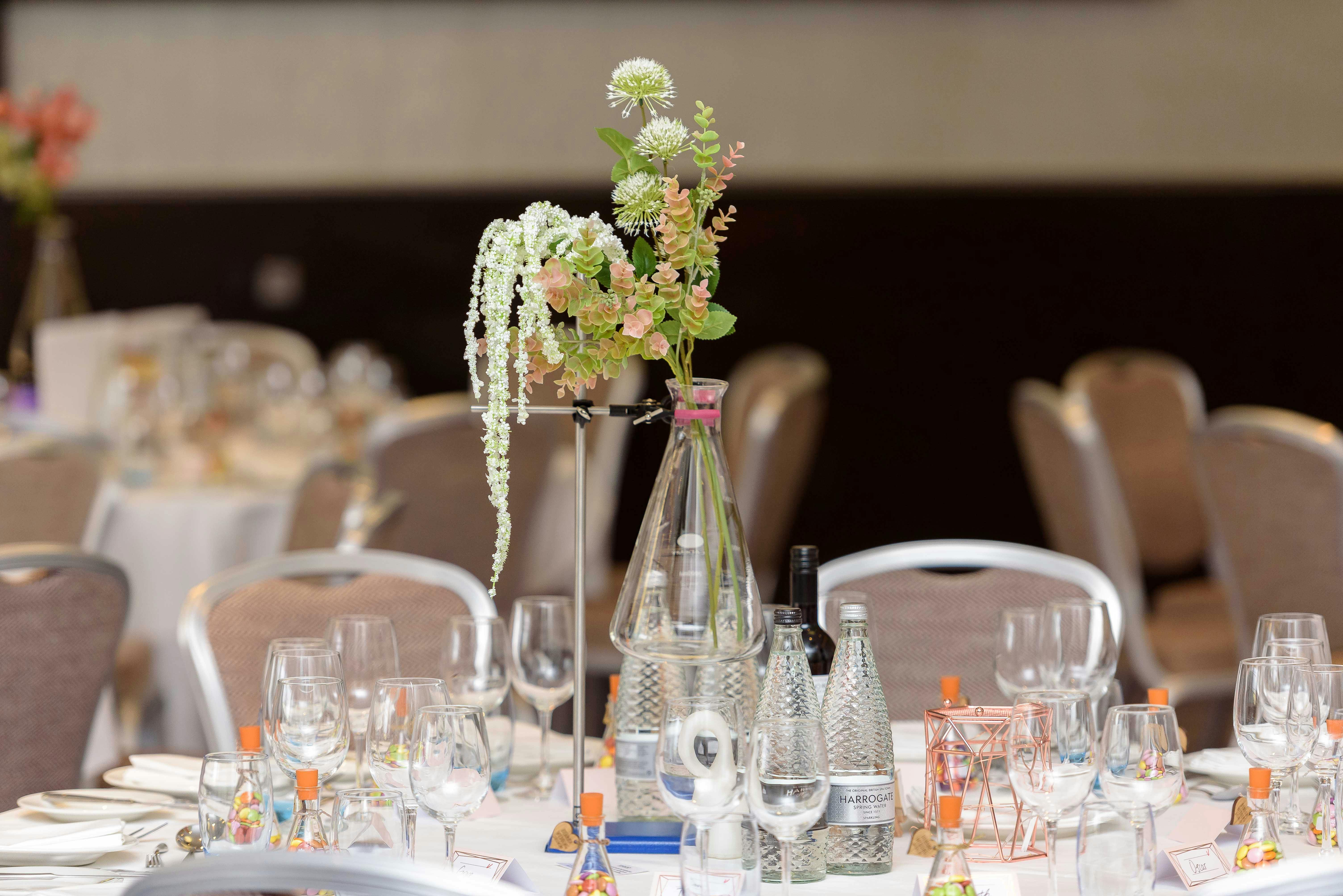 Elegant dining table with floral centerpiece at Tower AB, Hilton London Tower Bridge.