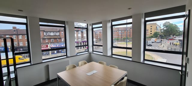 Modern Southpoint House meeting room with large windows for vibrant corporate events.