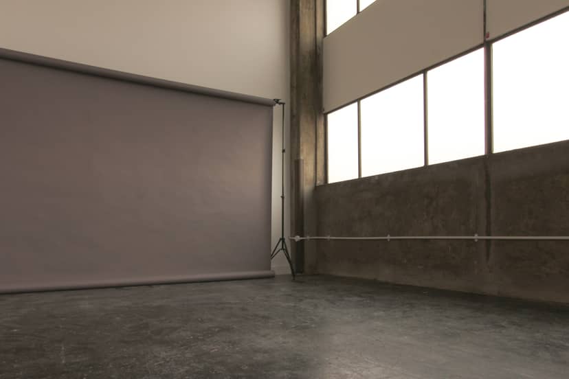 Versatile event space in Aseptic Studios with natural light, perfect for workshops and presentations.
