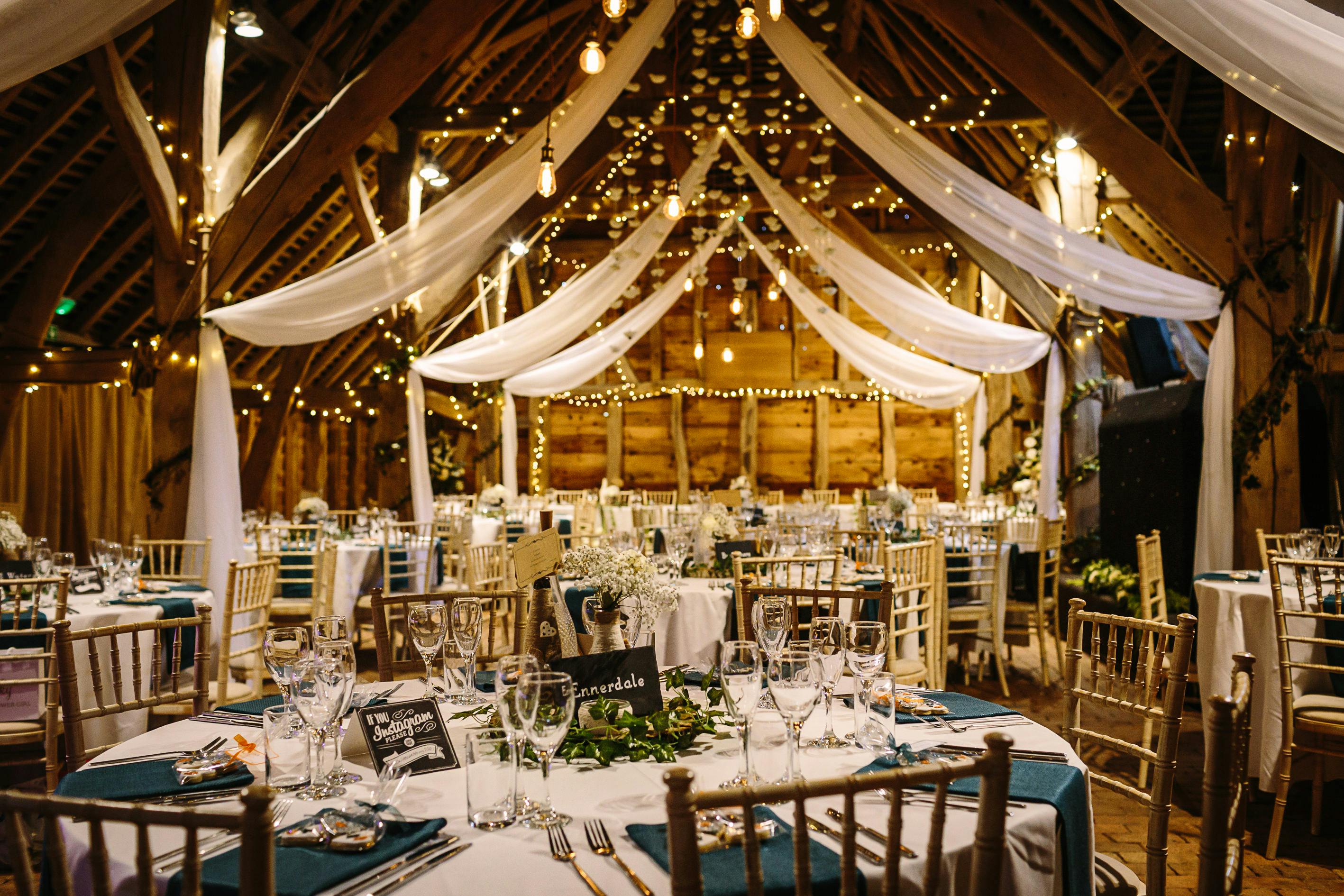 Elegant wedding venue with warm lighting and rustic charm at Gildings Barns.