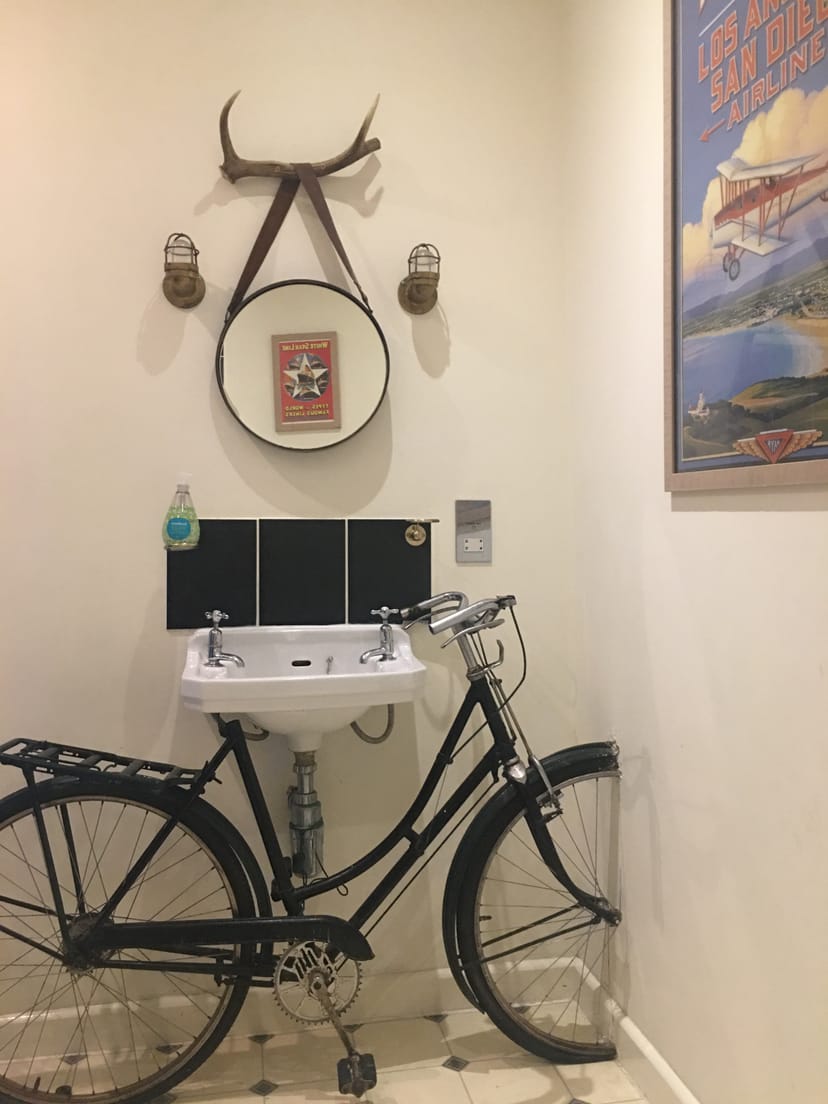 Vintage bicycle restroom setup in Koa Tree, enhancing event ambiance and guest experience.