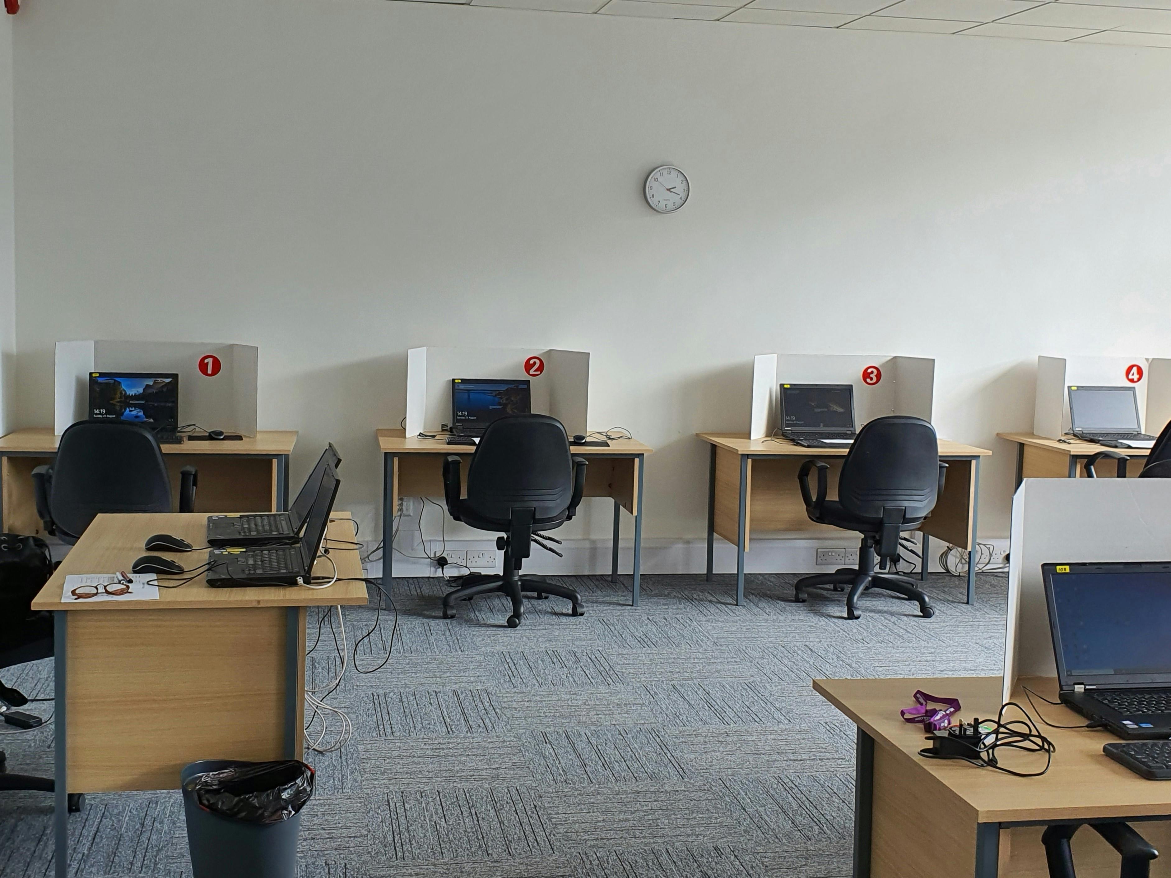 Exam training room with organized workstations for productivity and collaboration.