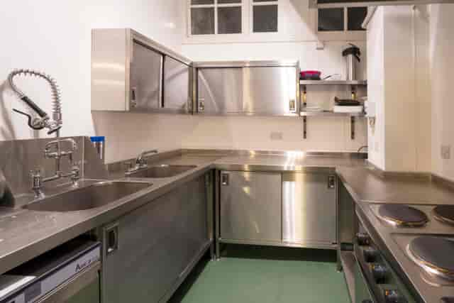 Clean commercial kitchen in Unity Islington, stainless steel surfaces for catering events.