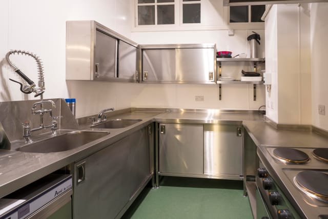 Clean commercial kitchen in Unity Islington, stainless steel surfaces for catering events.