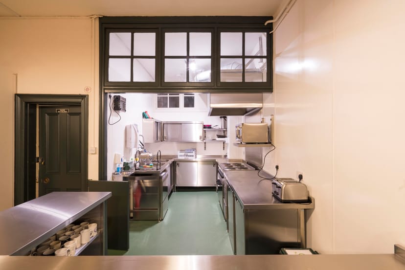 Commercial kitchen in Unity Islington, stainless steel surfaces, catering events setup.