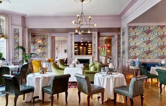 Elegant dining space in The Kensington's White Room, perfect for upscale events and gatherings.