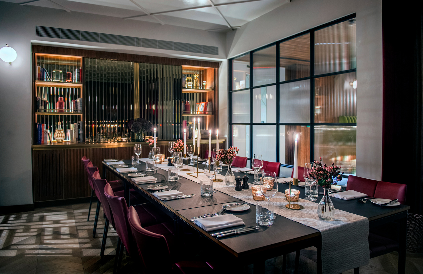 Elegant dining table with candles in The Marylebone for intimate gatherings and corporate dinners. - Banner