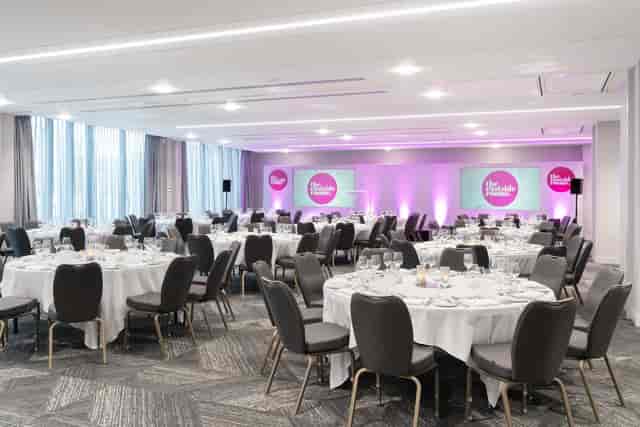 Belmont Suite event space with elegant round tables for banquets and conferences.