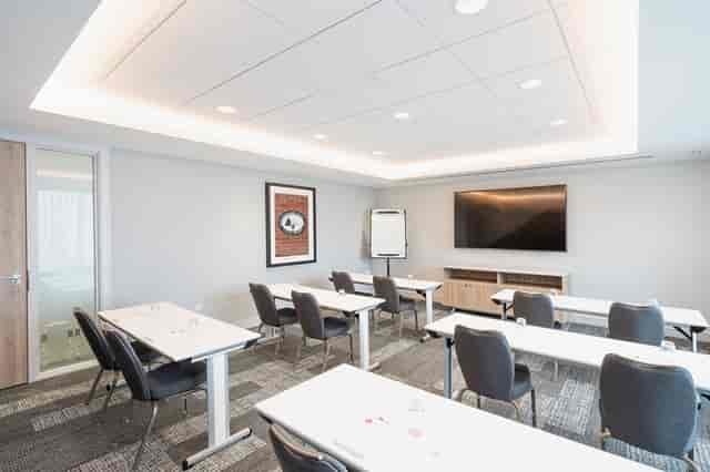 Modern Meeting Room Ten with sleek tables, ideal for workshops and corporate meetings.