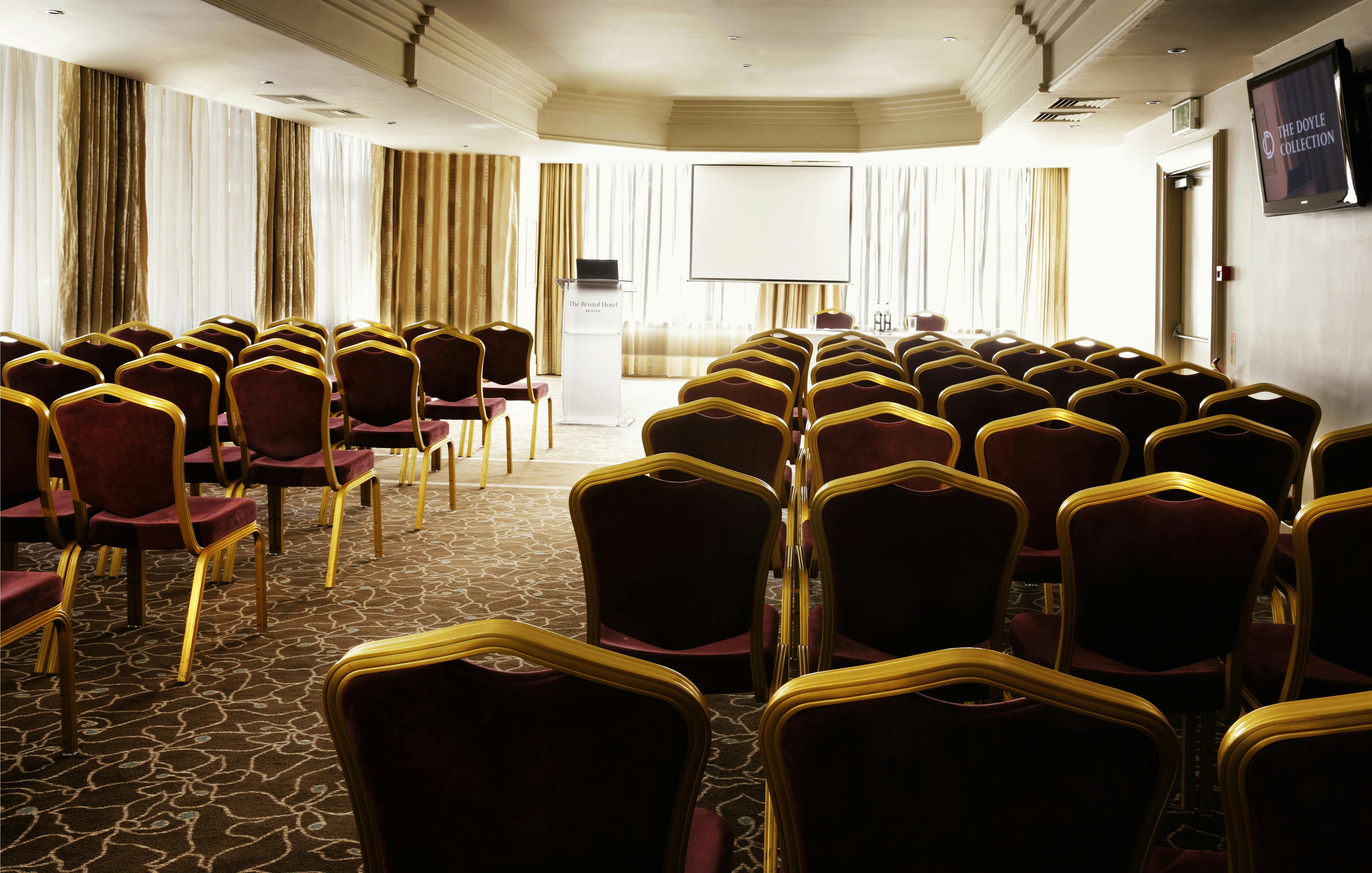 William Jessop Suite meeting room with projector screen for conferences and workshops.