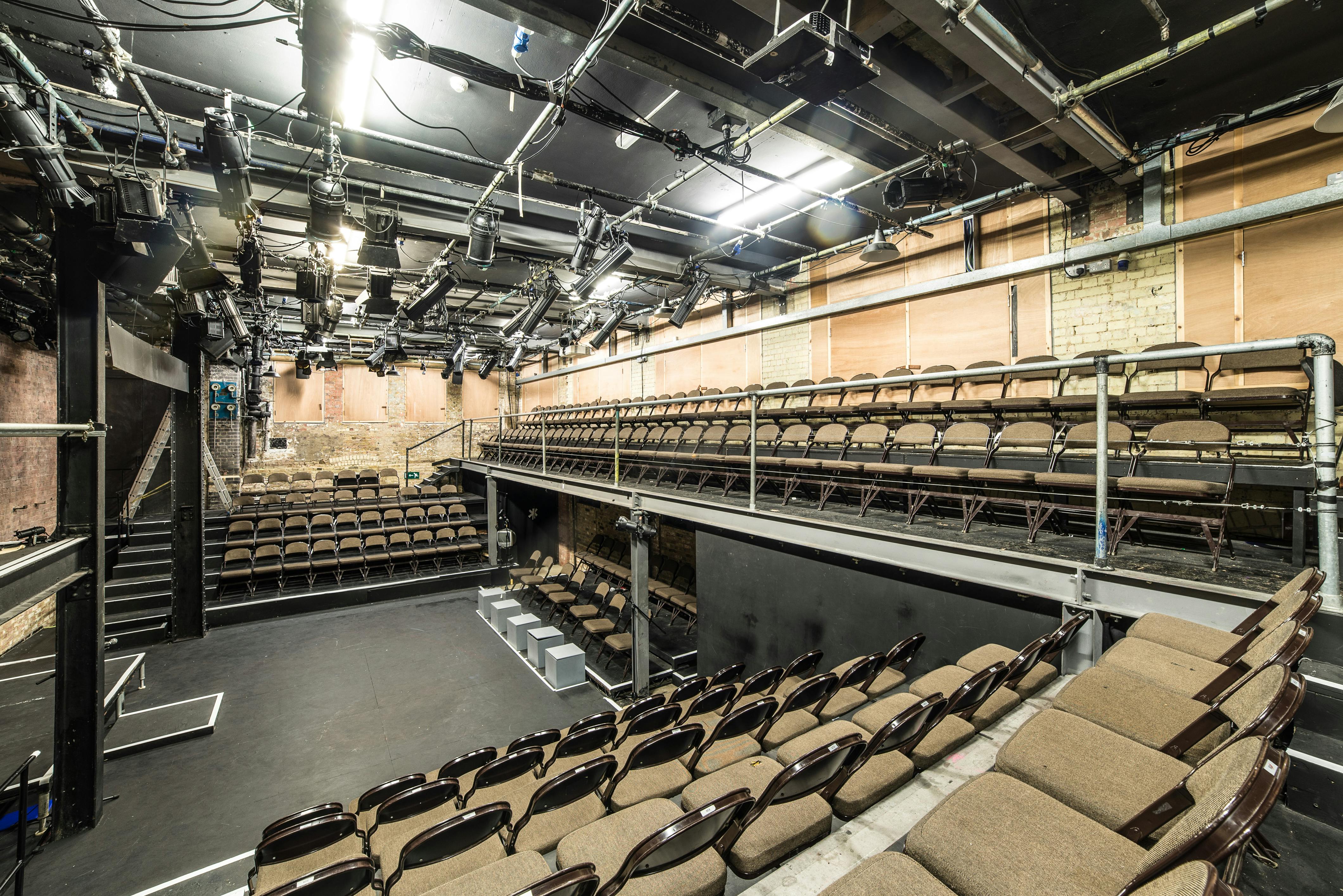 "Intimate theater space with tiered seating for workshops and performances at Arcola Theatre."