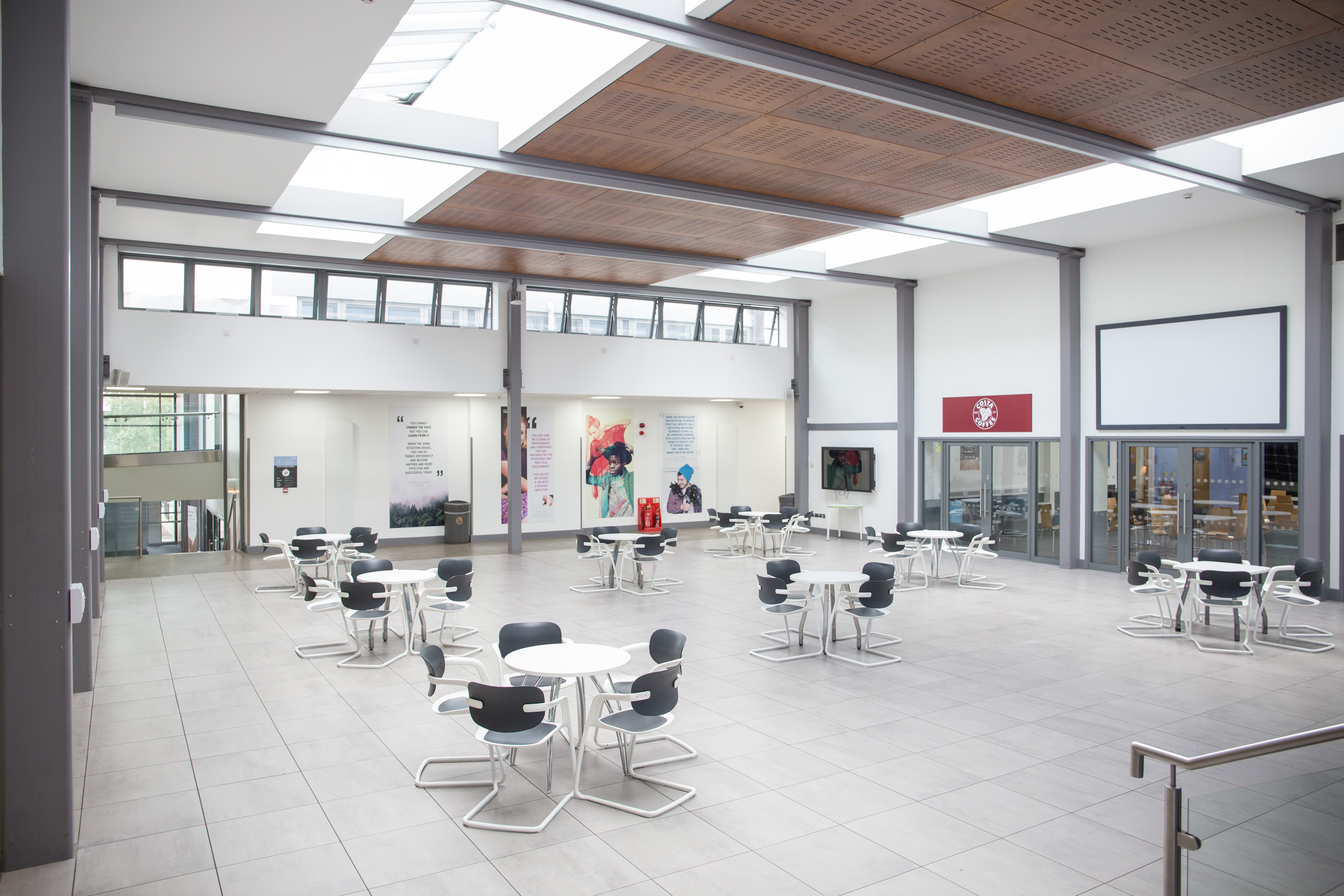 Spacious Heartspace event venue at Chesterfield College, ideal for networking and workshops. - Banner