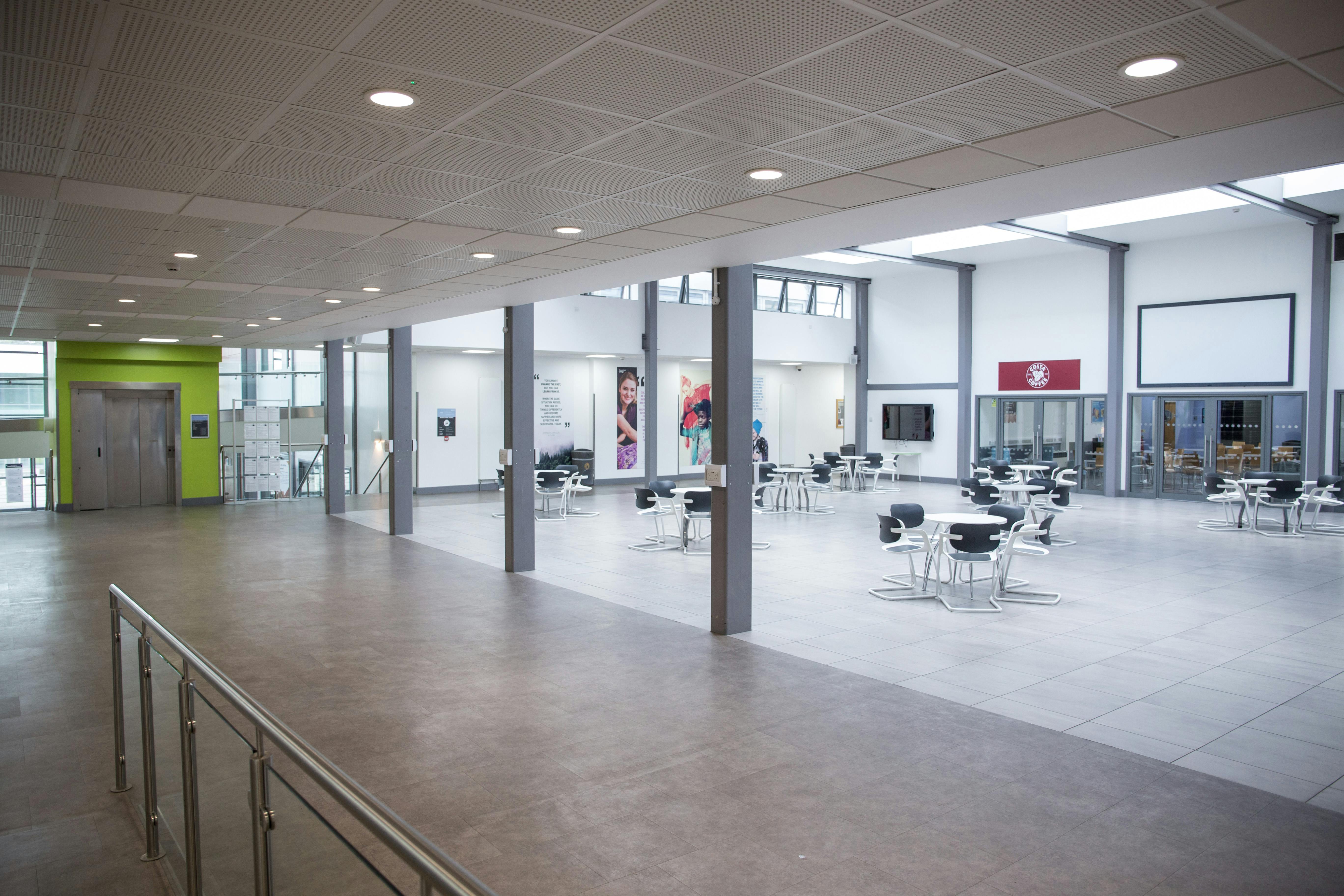 Modern event space at Chesterfield College with natural light, ideal for workshops and networking.