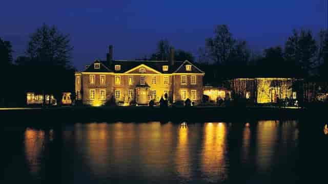 Orangery at Chilston Park Hotel, elegant venue by serene lake for upscale events.