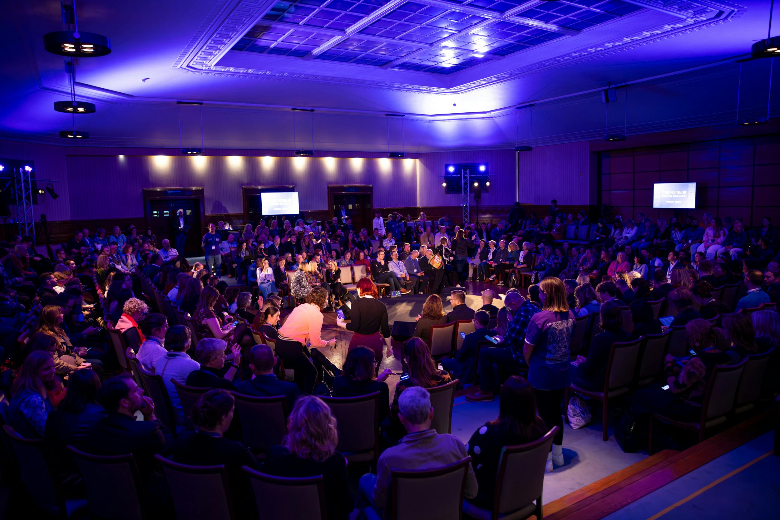 Beveridge Hall event with engaged audience and multimedia setup at University of London.