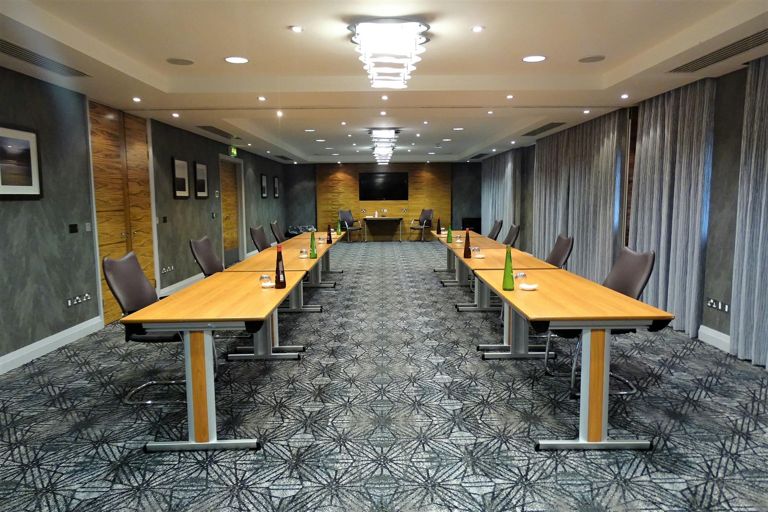 Wybunbury meeting room at Rookery Hall, U-shaped tables for professional events.