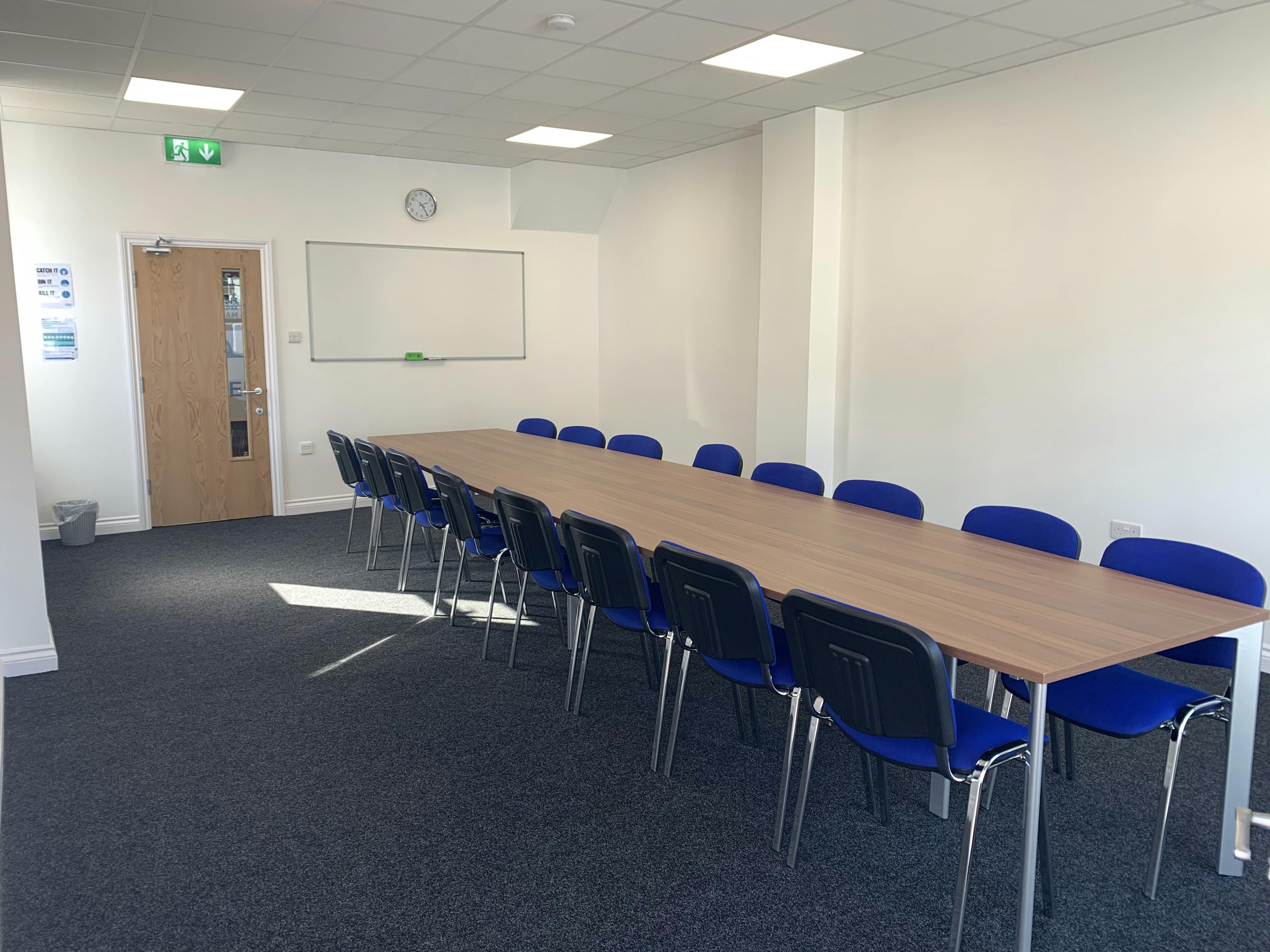 Meeting Room 1 at Bridge School: bright space with a long table, ideal for presentations and discussions.