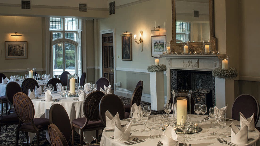 Elegant dining room at Rhinefield House Hotel, perfect for upscale events and formal dinners.