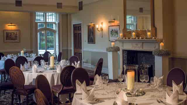 Elegant dining room at Rhinefield House Hotel, perfect for upscale events and formal dinners.
