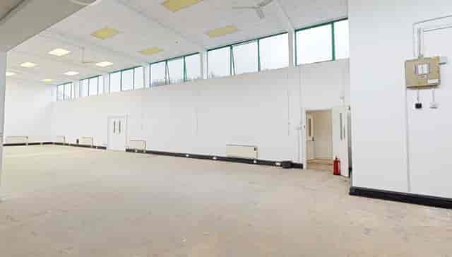 Spacious event venue in Moxon House with natural light, ideal for meetings and workshops.