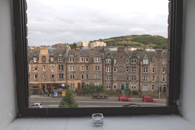 "Studio 5.03 window view of historic buildings, ideal for inspiring meetings and events."