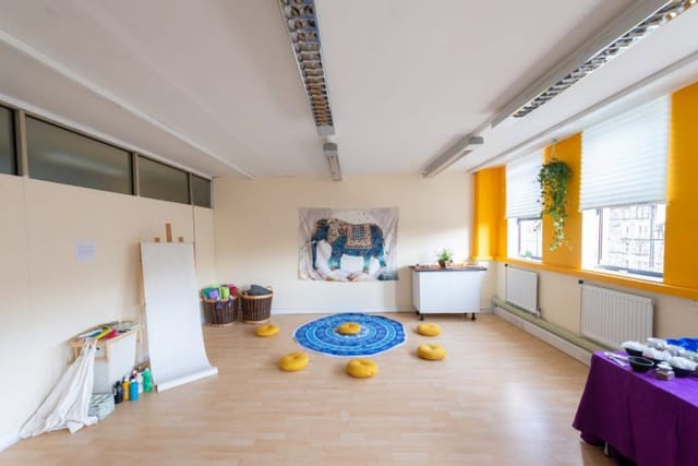 Versatile meeting space with cushions for workshops and events at St. Margaret's House.