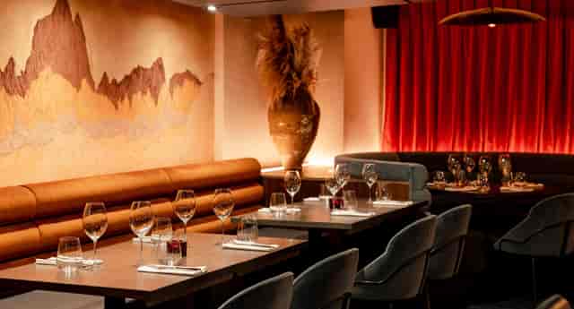 Private dining room with banquette seating for executive dinners and networking events.