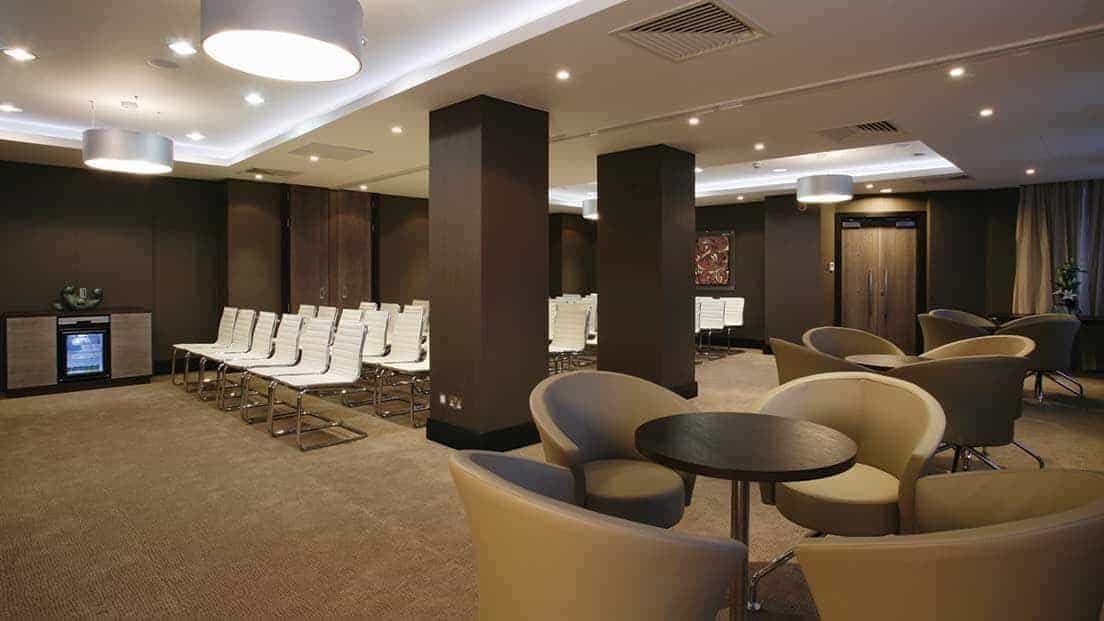 Leopold Suite at Grand Jersey Hotel, modern meeting space for seminars and networking.