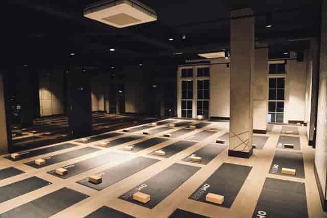 Spacious yoga studio with mats, ideal for wellness events and corporate retreats.