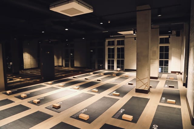 Spacious yoga studio with mats, ideal for wellness events and corporate retreats.