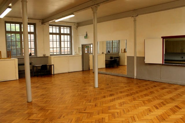 Spacious Lower Hall in Hargrave Hall, ideal for meetings and workshops with polished flooring.