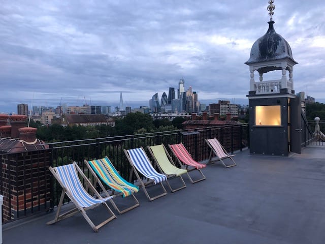 Stylish rooftop venue with city skyline, perfect for networking events and summer gatherings.