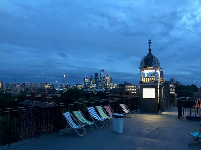 Rooftop terrace at Oxford House with city skyline, ideal for evening events and gatherings.