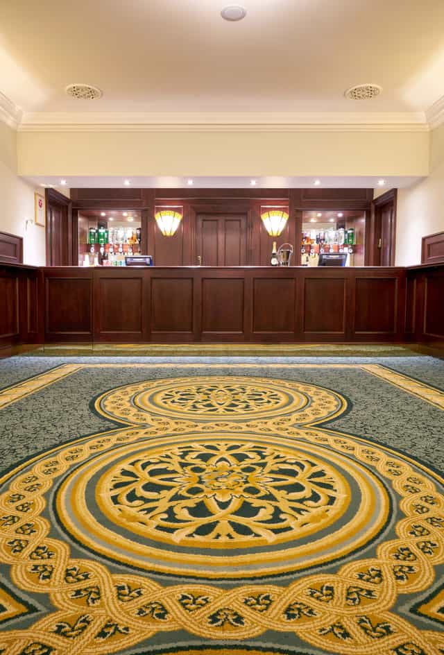 Aldwych Theatre Auditorium with elegant bar, ideal for upscale events and gatherings.