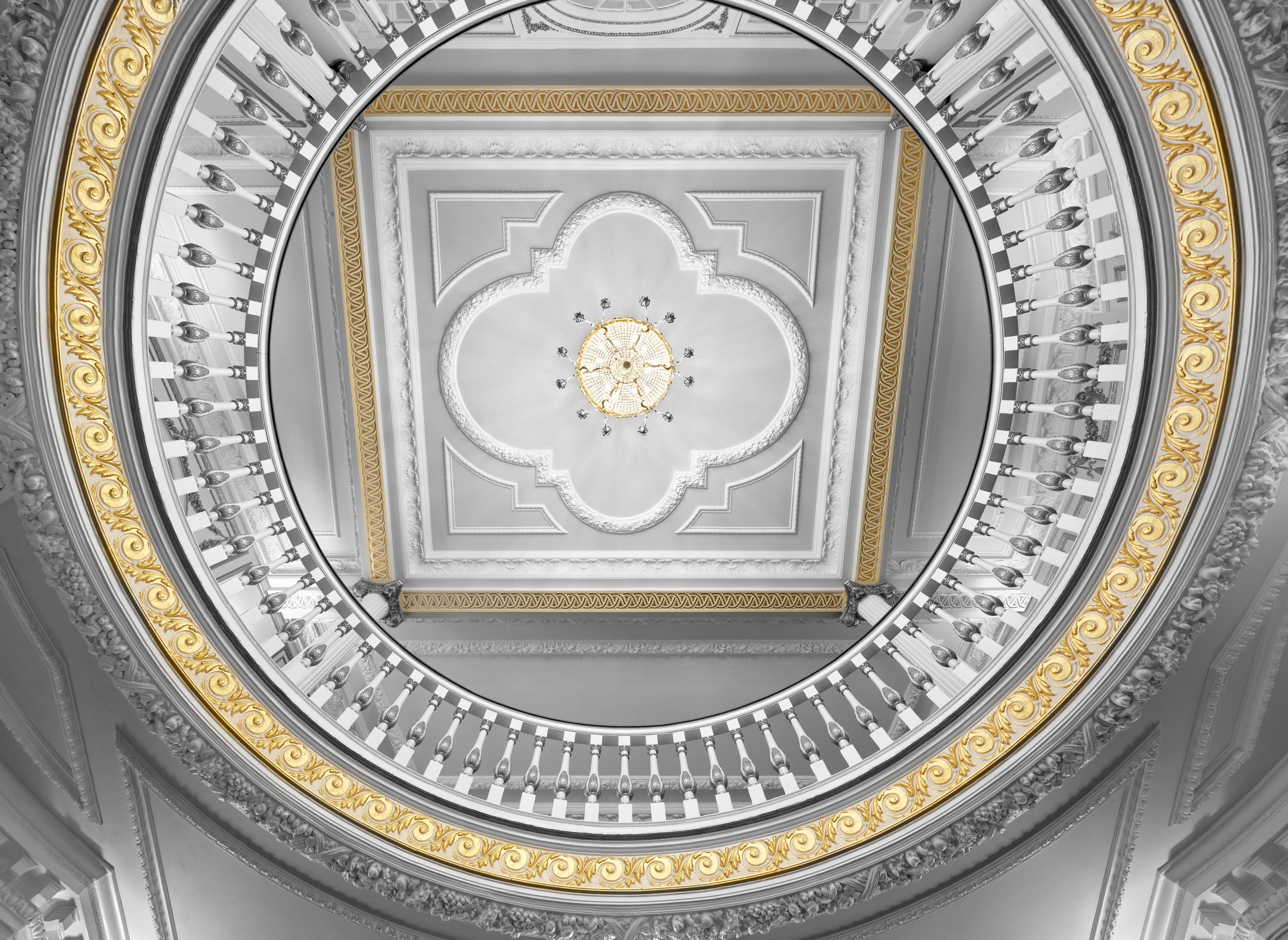 Aldwych Theatre Auditorium with elegant circular staircase, perfect for upscale events. - Banner