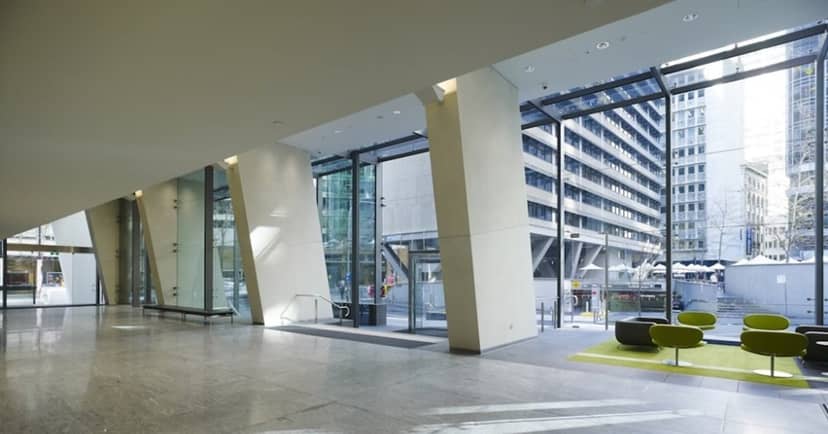 Modern 14-person meeting space with large windows, ideal for corporate events and networking.