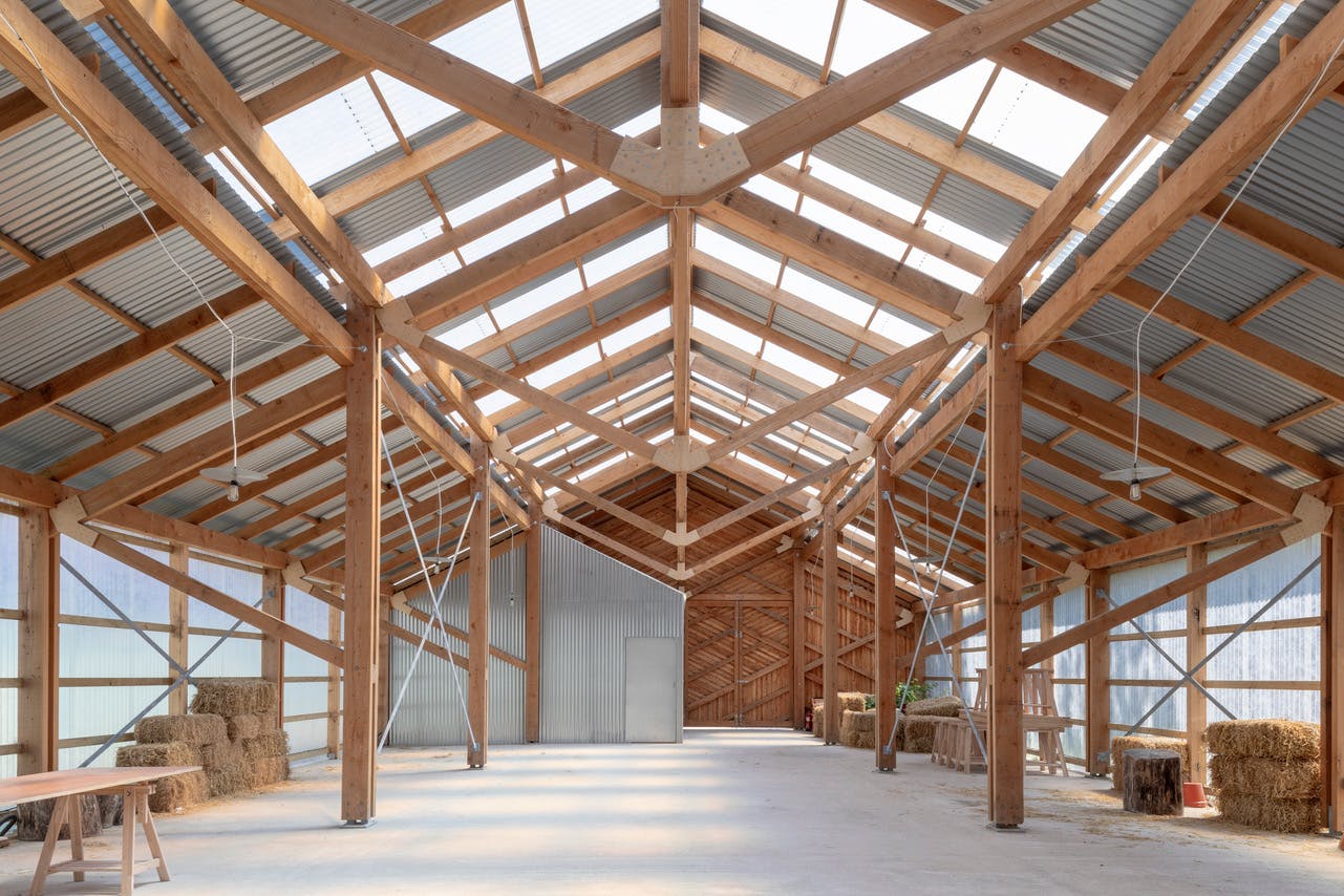 Rustic barn venue with high wooden ceiling for unique events at Oasis Farm Waterloo.