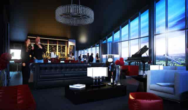 Sophisticated meeting space at Hotel La Tour with plush seating and elegant piano.
