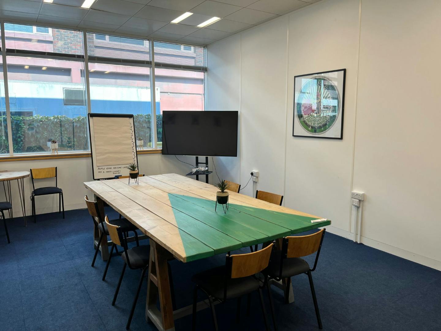 Modern meeting room with large table for collaboration at Freedom Works, Gatwick.